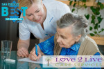 senior caregiver helping senior with legal docutments